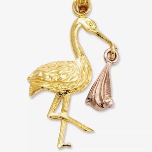 Gold and rose gold stork charm (0.91 grams)
